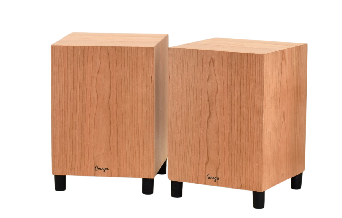 Two Omega DeepHemp 8 subwoofers made of hemp with a cherry wooden finish, positioned upright and side by side.