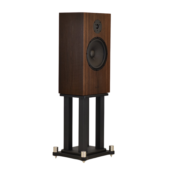 omega dynaten j25 on stands with black grills facinmg right in fumed white oak