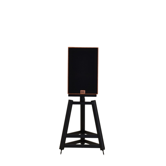 front view of omega speakers baby alnico monitor showing full black grill with copper emblem on tripod stands